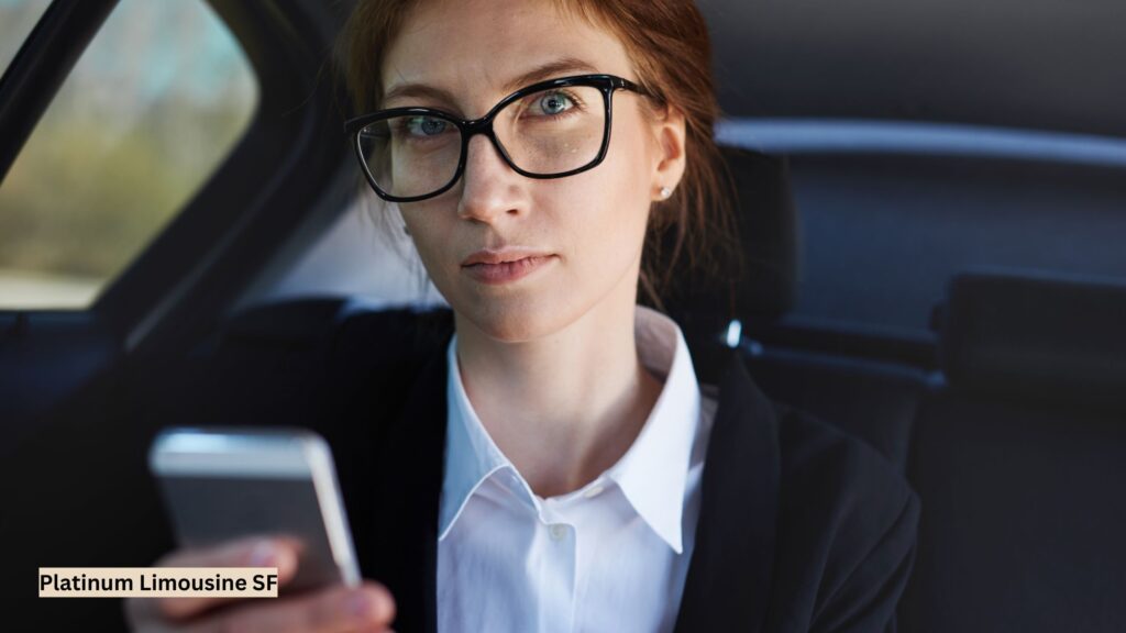 Professional businesswoman relaxing in the backseat of a luxury sedan, enjoying a comfortable chauffeured ride during her city commute.